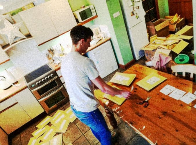 Early operations of The Face Mask Store UK, packing orders from a home kitchen.